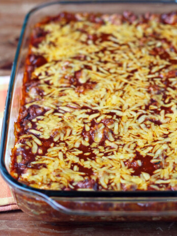 Layered Meat and Bean Enchilada Bake in a dish