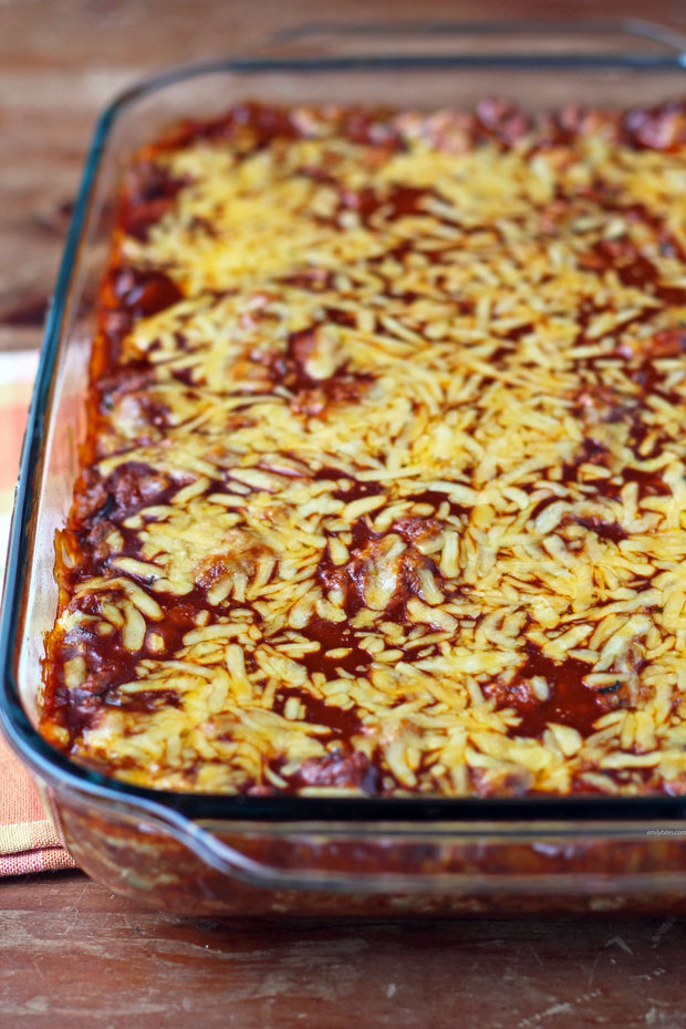 Layered Meat and Bean Enchilada Bake in a dish