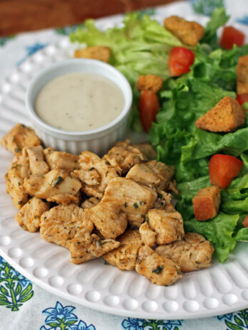 Pickle Brined Chicken Bites on a plate with ranch