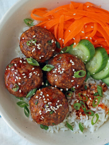 Spicy Korean-Inspired Meatballs with rice, carrots, and cucumbers