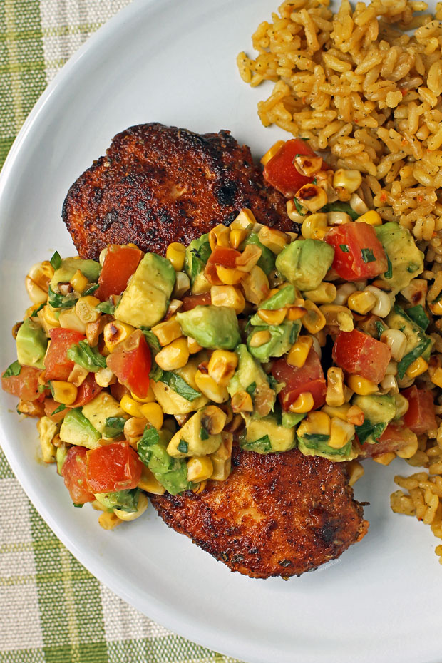Blackened Chicken with Avocado Corn Topping plated with rice