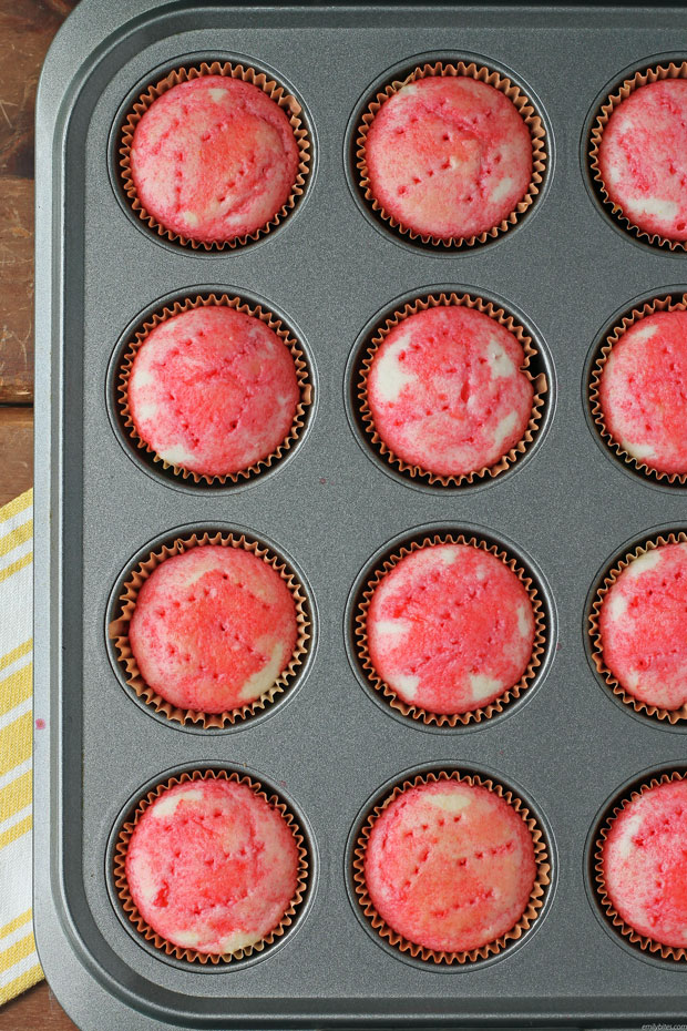 Strawberry Jell-O Poke Cupcake in the pan, no topping