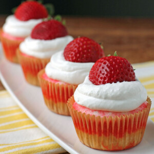 Strawberry Jell-O Poke Cupcakes in a row