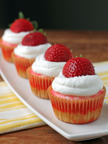 Strawberry Jell-O Poke Cupcakes in a row