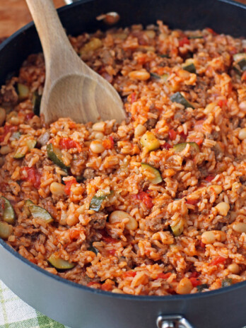 Italian Sausage Bean and Rice Skillet stirred with a spoon