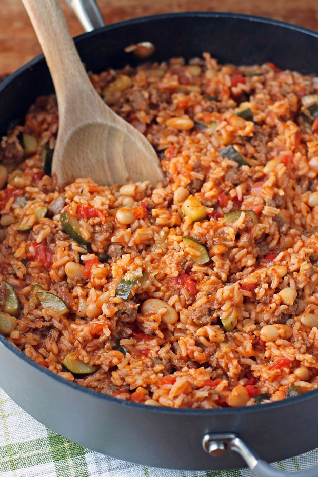 Italian Sausage Bean and Rice Skillet stirred with a spoon