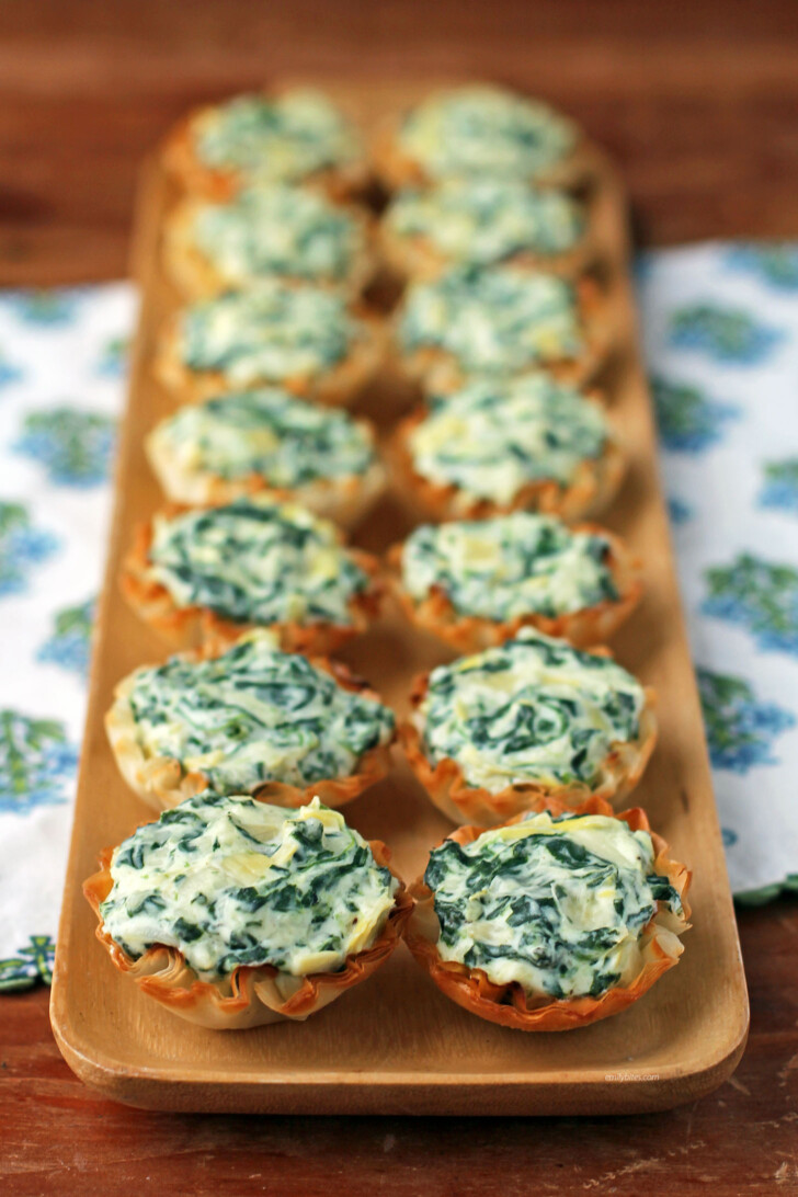 Spinach Artichoke Dip Tartlets close up in rows
