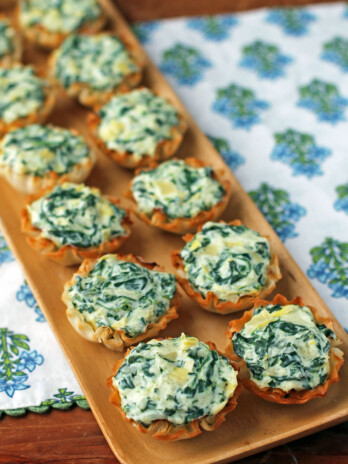 Spinach Artichoke Dip Tartlets on a tray