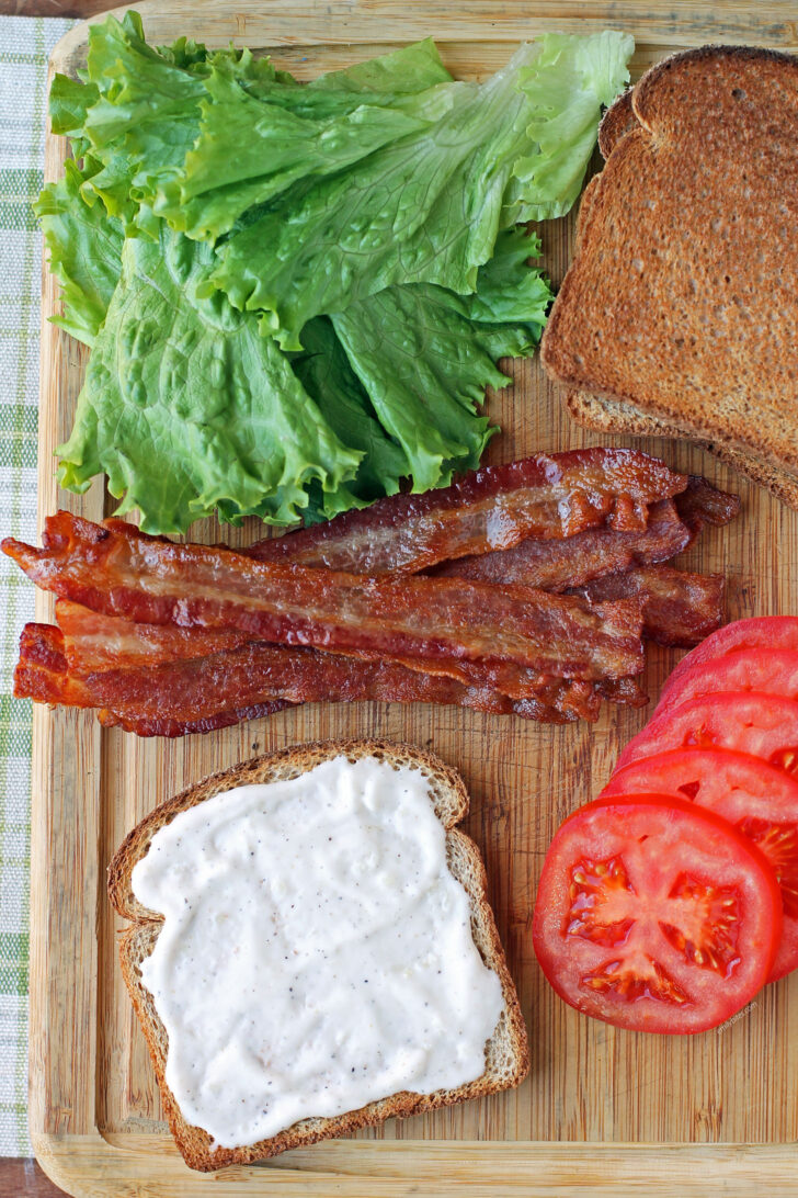 BLT Sandwich with Garlic Aioli ingredients on a cutting board