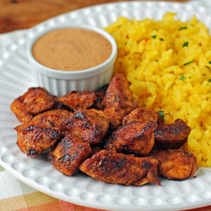 Mexi Chicken Bites plated with rice and dipping sauce