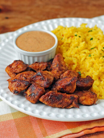 Mexi Chicken Bites plated with rice and dipping sauce