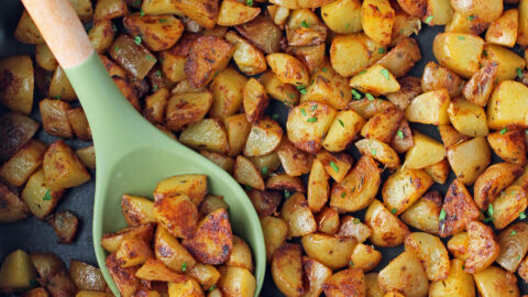 Skillet Breakfast Potatoes in a pan with a spoon
