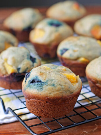 Peach Blueberry Muffins on a cooling rack