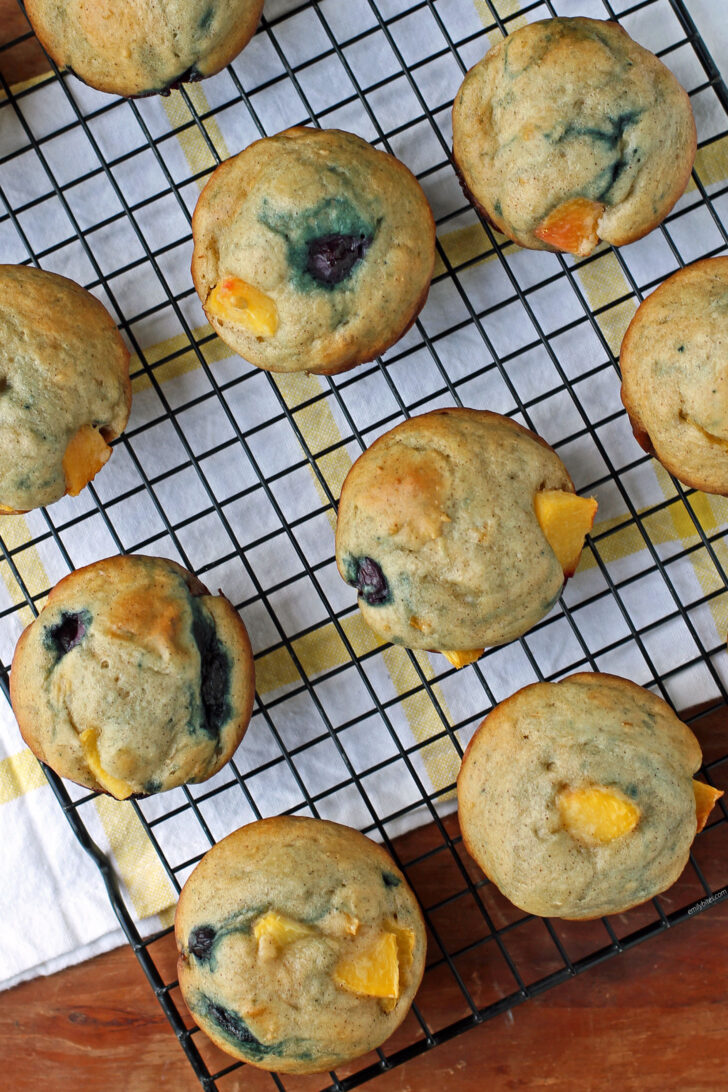 Peach Blueberry Muffins overhead on a cooling rack