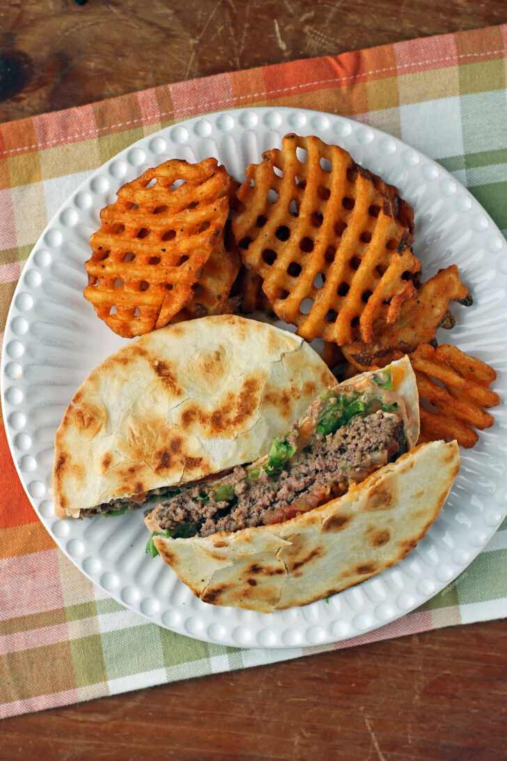 Quesadilla Burger with fries on a plate