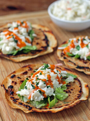 Buffalo Chicken Smashed Tacos close up on a cutting board
