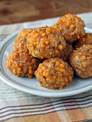 Bisquick Chicken Sausage Balls stacked on a plate close up