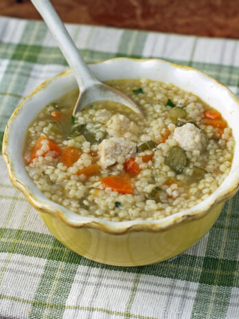 Chicken and Stars Soup in a bowl with a spoon