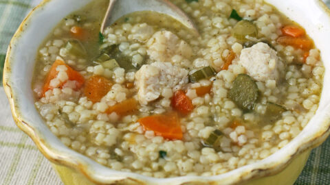 Chicken and Stars Soup in a bowl with a spoon