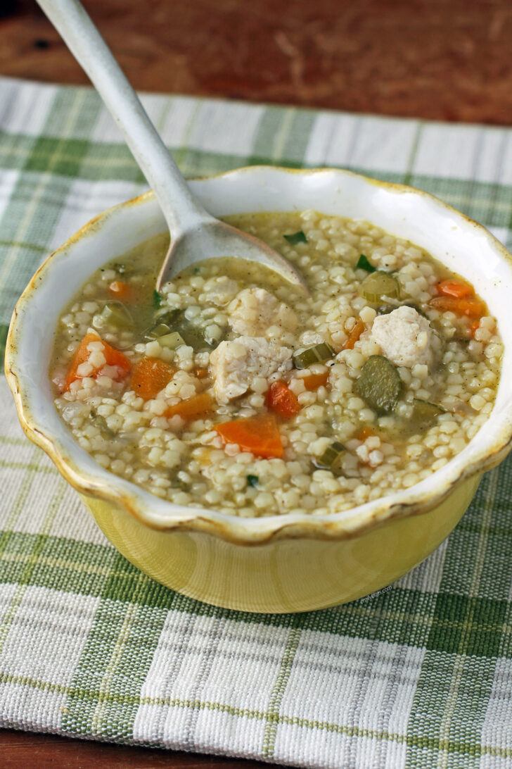Chicken and Stars Soup in a bowl with a spoon