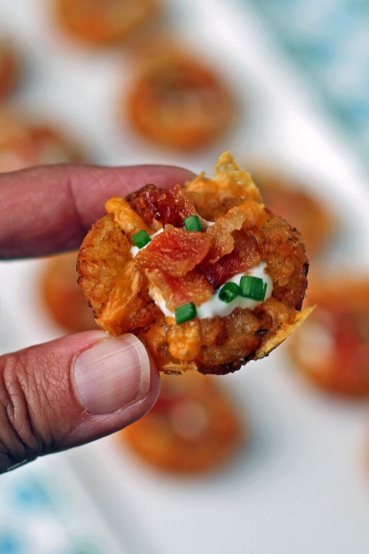 Mini Loaded Tater Tot Cup in hand