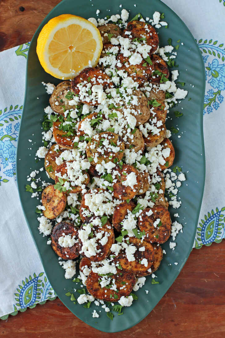 Greek Roasted Potatoes with Feta on a platter