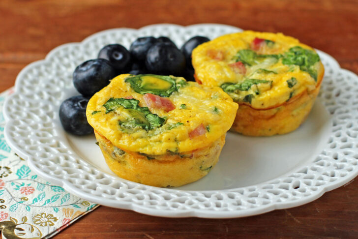 Two Ham and Swiss Egg Cups on a plate