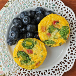 Ham and Swiss Egg Cups plated with blueberries