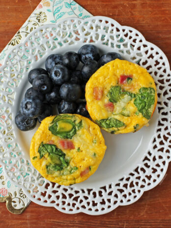 Ham and Swiss Egg Cups plated with blueberries