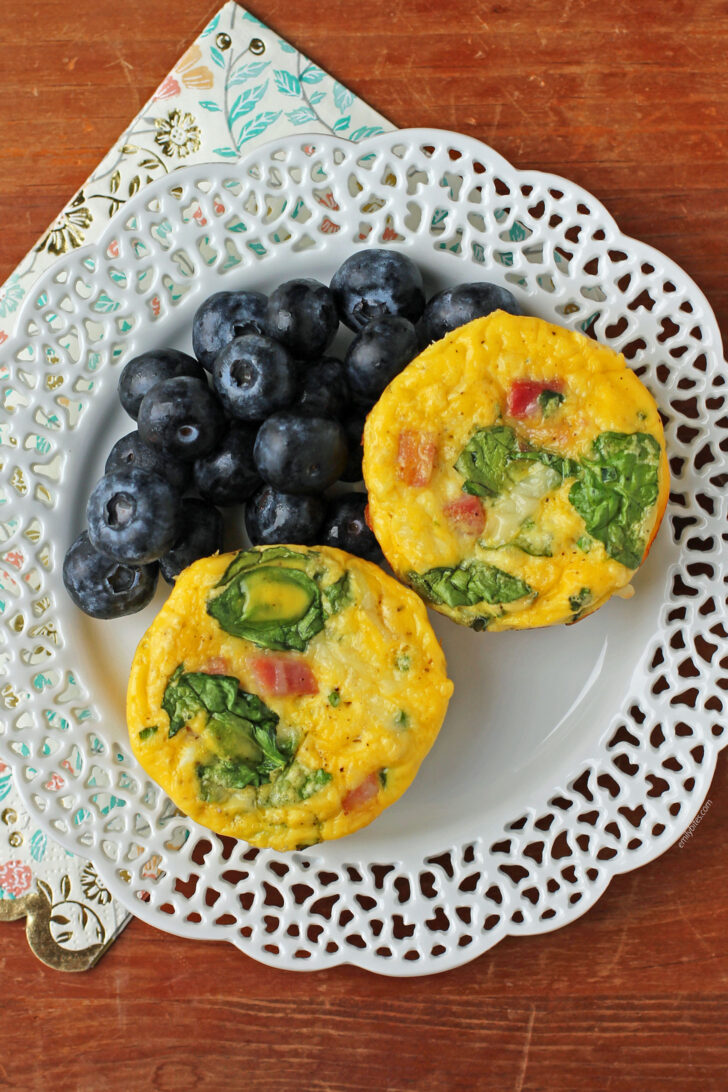 Ham and Swiss Egg Cups plated with blueberries