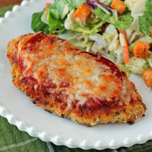 Chicken Pizzesan plated with salad