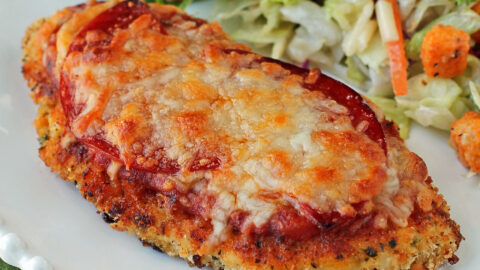 Chicken Pizzesan plated with salad