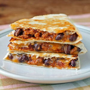 Chorizo Black Bean Quesadilla stacked on a plate