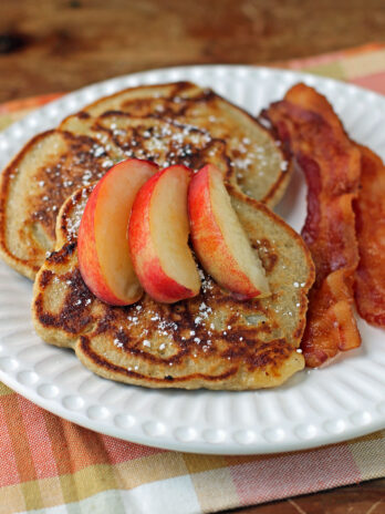 Peach Oatmeal Pancakes plated with bacon