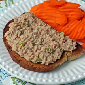 Easy Tuna Salad on rye toast plated with carrots