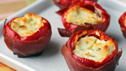 Prosciutto Wrapped Stuffed Cherry Peppers on a plate