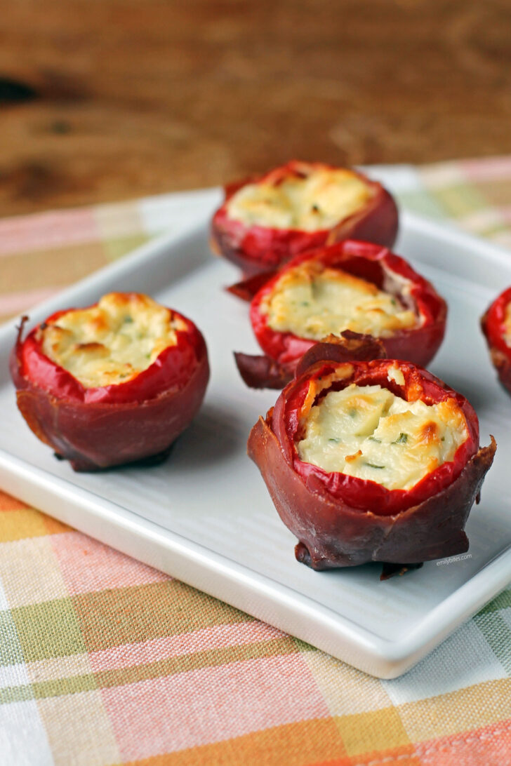 Prosciutto Wrapped Stuffed Cherry Peppers on a plate