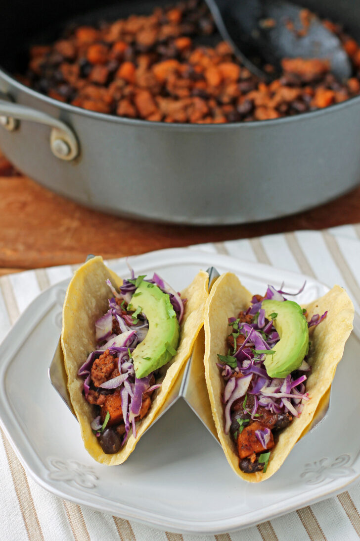 Chorizo Sweet Potato and Black Bean Tacos in a taco stand